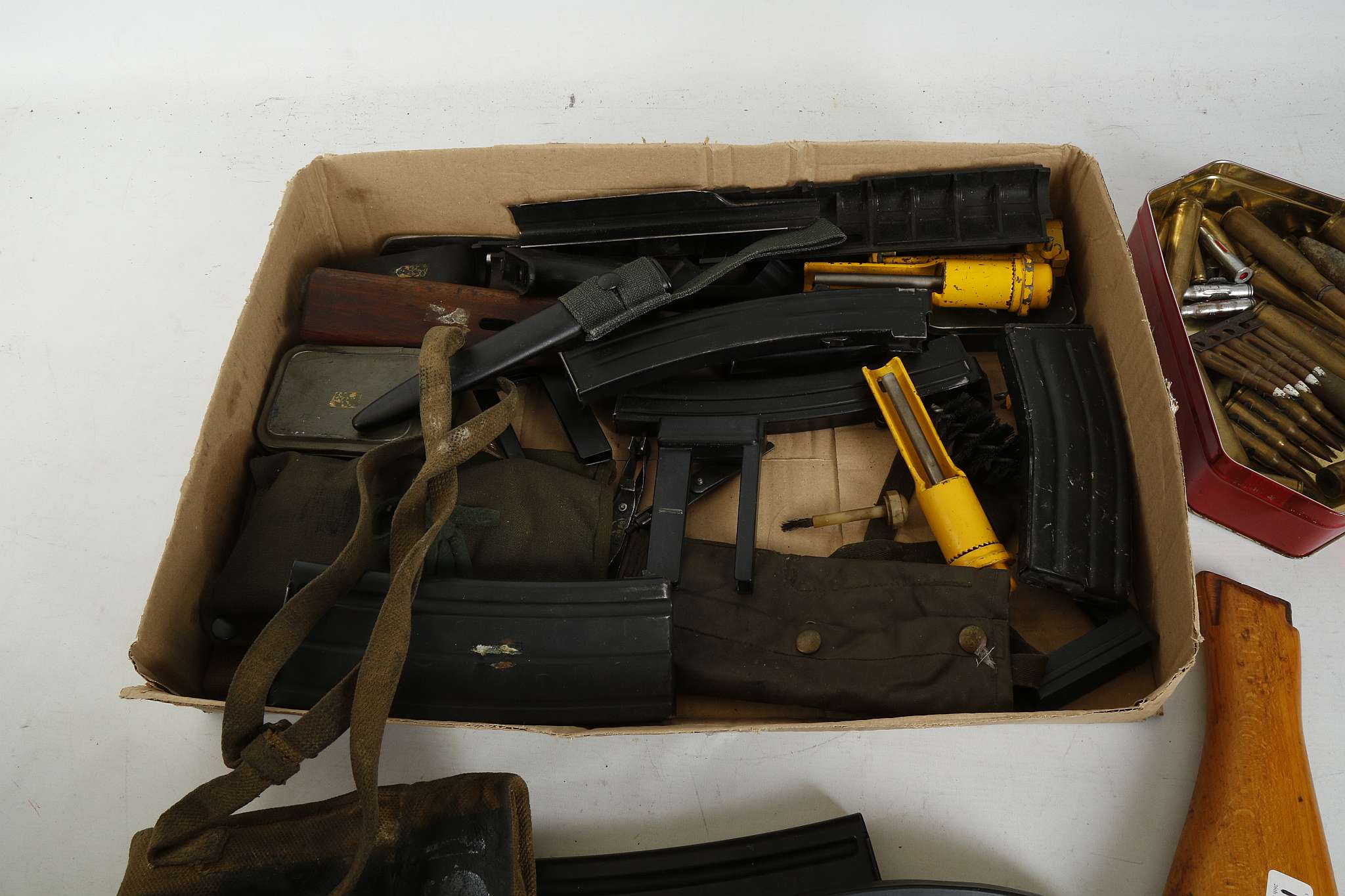 A COLLECTION OF RIFLE AND MACHINE GUN MAGAZINES, cleaning kits for personal weapons and spent - Image 2 of 3
