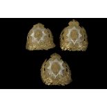 THREE 19th CENTURY LIFE GUARDS HELMET BADGES, in brass and white metal, 18.2cm.