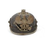 A WWI 1860 PATTERN GERMAN 'PICKELHAUBE' HELMET, with Infantry Badge, peak vent, adjustable visor and