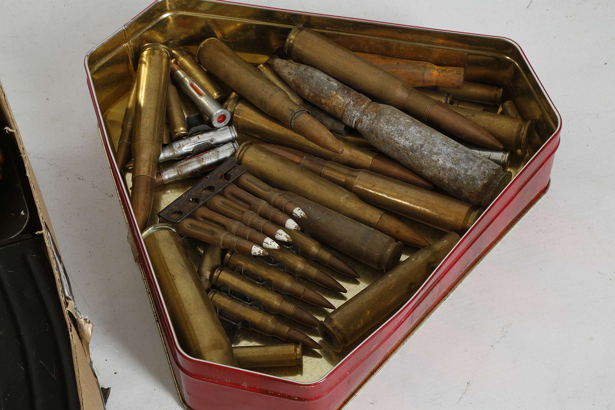 A COLLECTION OF RIFLE AND MACHINE GUN MAGAZINES, cleaning kits for personal weapons and spent - Image 3 of 3