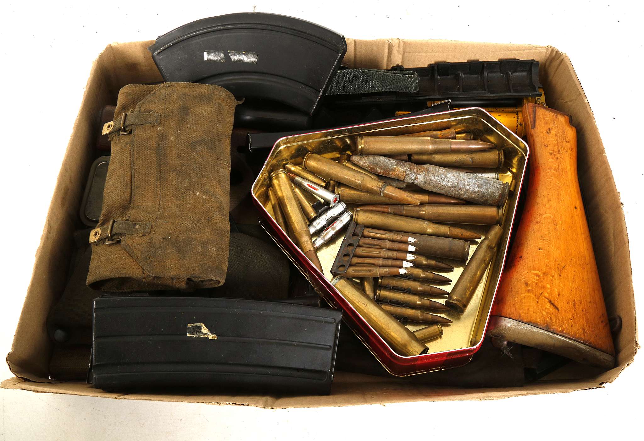 A COLLECTION OF RIFLE AND MACHINE GUN MAGAZINES, cleaning kits for personal weapons and spent