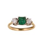 An emerald and diamond three-stone ring The square step-cut emerald between brilliant and old