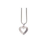 A diamond heart pendant necklace The openwork heart pendant set with baguette and tapered baguette-