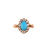 A late 19th century turquoise and diamond cluster ring The oval cabochon turquoise within a surround