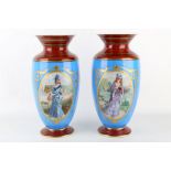 A pair of late 19th Century French porcelain baluster shaped vases, both decorated with pretty