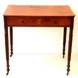 George IV mahogany writing table, with rosewood banded top, over frieze drawer on wrythen fluted