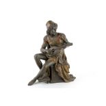 An early 20th Century Spelter figure of an Italianate man sat upon a pedestal playing a lute, with