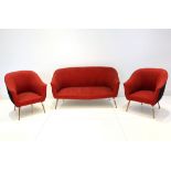 A 1950s ITALIAN THREE PIECE SUITE, consisting of a two seater sofa and two armchairs, on gilt