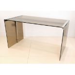 A 1970s SMOKED GLASS DESK BY GALLOTTI & RADICE, with chromed edge corner supports, (138 x 70 x