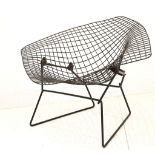 A 1960s WIDE WIRE CHAIR, manufactured by Knoll International, in black powder coated finish (111cm