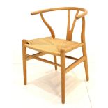 A 1960s HANS WEGNER OAK WISHBONE CHAIR, with papercord seat, manufactured by Carl Hansen & Son,