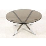 A 1960s CIRCULAR ITALIAN COFFEE TABLE, with smoked glass top, on chrome steel base (100 x 47cm