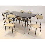 A 1950s ITALIAN DINING TABLE AND SIX CHAIRS, with black glass inlaid top, black lacquered steel base