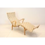 A MID 20th CENTURY CHAISE, designed by Bruno Mathesson, manufactured by Dux, with canvas woven seat,