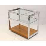 A 1970s Merrow Associates drinks trolley, with two glass tiers and teak base, (73.5 x 46 x 63cm