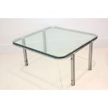 A 1960s SQUARE COFFEE TABLE, designed by Horst Brunig, with glass top, on flat steel base, (76 x