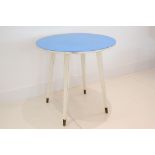 A 1950s BREAKFAST TABLE, DESIGNED BY GIO PONTI FOR THE HOTEL PARC DI PRINCIPI, with blue circular