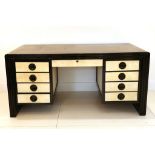 A 1950s ITALIAN PARCHMENT DESK DESIGNED BY OSVALDO BORDANI, with eight drawers, black lacquer