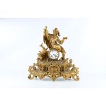 A LATE 19TH CENTURY FRENCH GILT METAL FIGURAL MANTEL CLOCK DEPICTING A HUNTER the seated figure