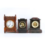 TWO LATE 19TH CENTURY BLACK AND RED MARBLE MANTEL CLOCKS TOGETHER WITH AN OAK MANTEL CLOCK BY