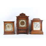 AN EARLY 20TH CENTURY OAK BRACKET CLOCK BY LENZKIRCH TOGETHER WITH TWO OTHERS of architectural form,