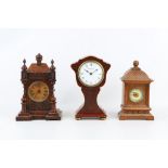 AN ART NOUVEAU STYLE FRENCH MANTEL CLOCK SIGNED BENNETFINK & CO LONDON TOGETHER WITH TWO FURTHER