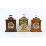 THREE SMALL 18TH CENTURY STYLE MANTEL CLOCKS comprising a brass example with silvered Roman