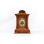 AN EARLY 20TH CENTURY OAK TRIPLE TRAIN WESTMINSTER CHIMING MANTEL CLOCK BY JUNGHANS the