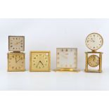 SIX VARIOUS GILT AND LACQUERED BRASS MANTEL CLOCKS including a square dial example signed 'Imexal