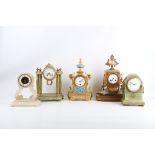 FIVE LATE 19TH FRENCH ALABASTER, ONYX AND PORCELAIN MOUNTED MANTEL CLOCKS comprising an onyx clock