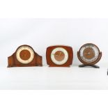 THREE SMITHS MANTEL CLOCKS including a circular example, a shaped rectangular example and an