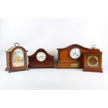 A 20TH CENTURY GEORGE III STYLE BRACKET CLOCK TOGETHER WITH THREE FURTHER MANTEL CLOCKS the George