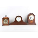 AN EARLY 20TH CENTURY FRENCH MAHOGANY MANTEL CLOCK OF 'NAPOLEON HAT' FORM TOGETHER WITH TWO