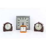 AN ART DECO STYLE CHROME CLOCK TOGETHER WITH TWO BAKELITE CLOCKS AND A DESK ALARM CLOCK the Art Deco