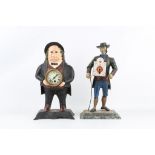 TWO 19TH CENTURY PAINTED METAL FIGURAL CLOCK the first modelled as a fat man wearing a hat and