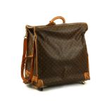 Louis Vuitton wheeled garment carrier, monogram canvas with tan leather trim, two hangers, on four