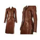 Hermes brown leather skirt suit, distressed leather with horn style buttons, the jacket fitted and