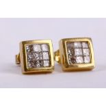 A pair of diamond earstuds Each square plaque invisibly-set with princess-cut diamonds, diamonds