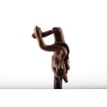 A BEAUTIFUL ONE PIECE FOLK ART CARVED FIGURAL CANE, with a man's face and various animals, 93cm.