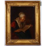 Circa late 18th Century Dutch school. Oil on canvas interior, an old lady reading. In period