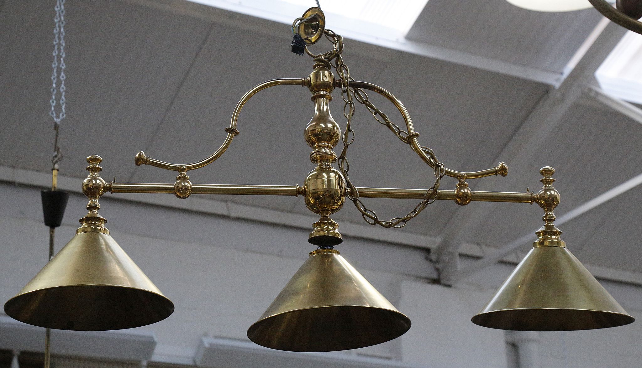 A reproduction brass billiard table light.
