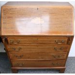 An Edwardian inlaid and crossbanded mahogany bureau, fitted with four long drawers on bracket