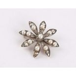 A Victorian gold / silver floral brooch, set with diamonds hand pearls. Note: pearls are later