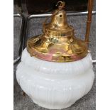 A pair of large 20th Century brass and copper ornamental glass hung ceiling lights, having