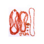 A small collection of coral corallium rubrum jewellery, Including a 19th century brooch, four carved