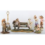 A collection of Capodimonte porcelain figures, 20th Century, to include a couple seated on a