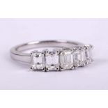 A diamond five-stone ring, The graduated line of baguette-cut diamonds, the largest to the centre,