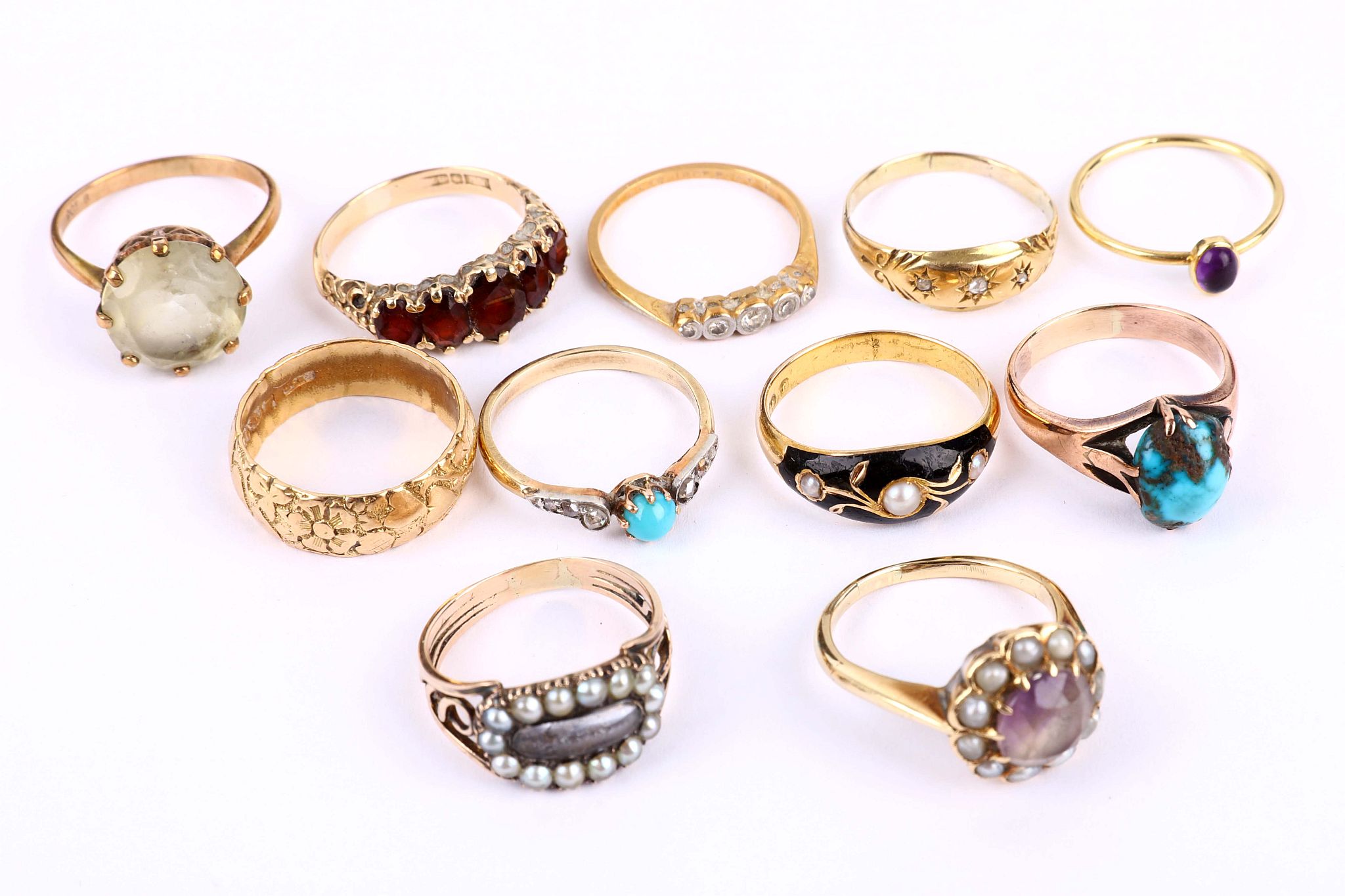 A collection of rings, Including two set with turquoise, two 19th century memorial rings, a five