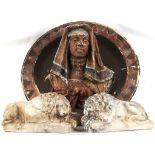 A goldscheider moulded and painted terracotta charger, with deep three dimensional Arab head, 60cm