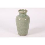 Chinese Ming, Loquan celadon vase, crackle glazed with floral motif, 11cm high